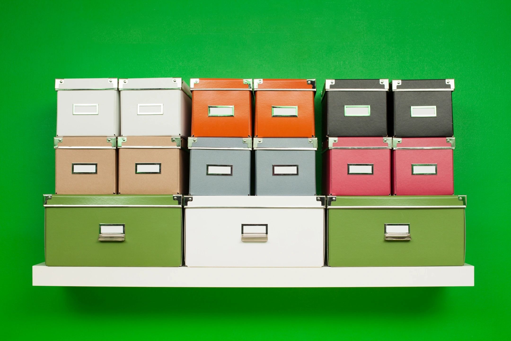 Colourful storage boxes organised on shelf