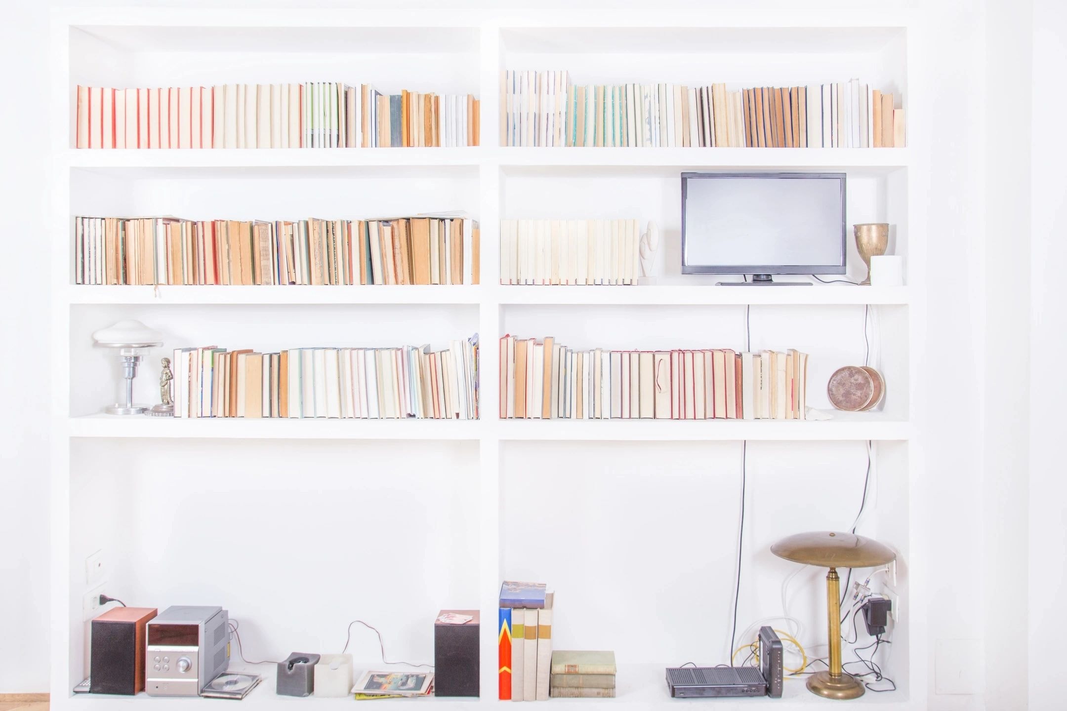Organised white shelving unit